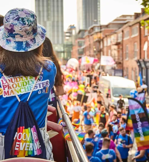 Booking.com LGBTQIA+ ERG Shines at Manchester Pride Parade with Double-Decker Bus detail 3